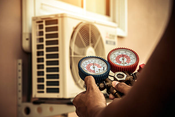 Professional Heat Pump Repair technician working in West Chicago, IL